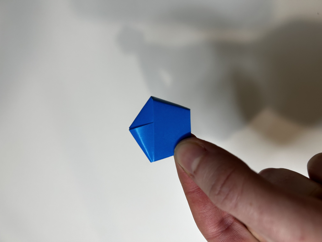Strip of paper in a pentagon shape.