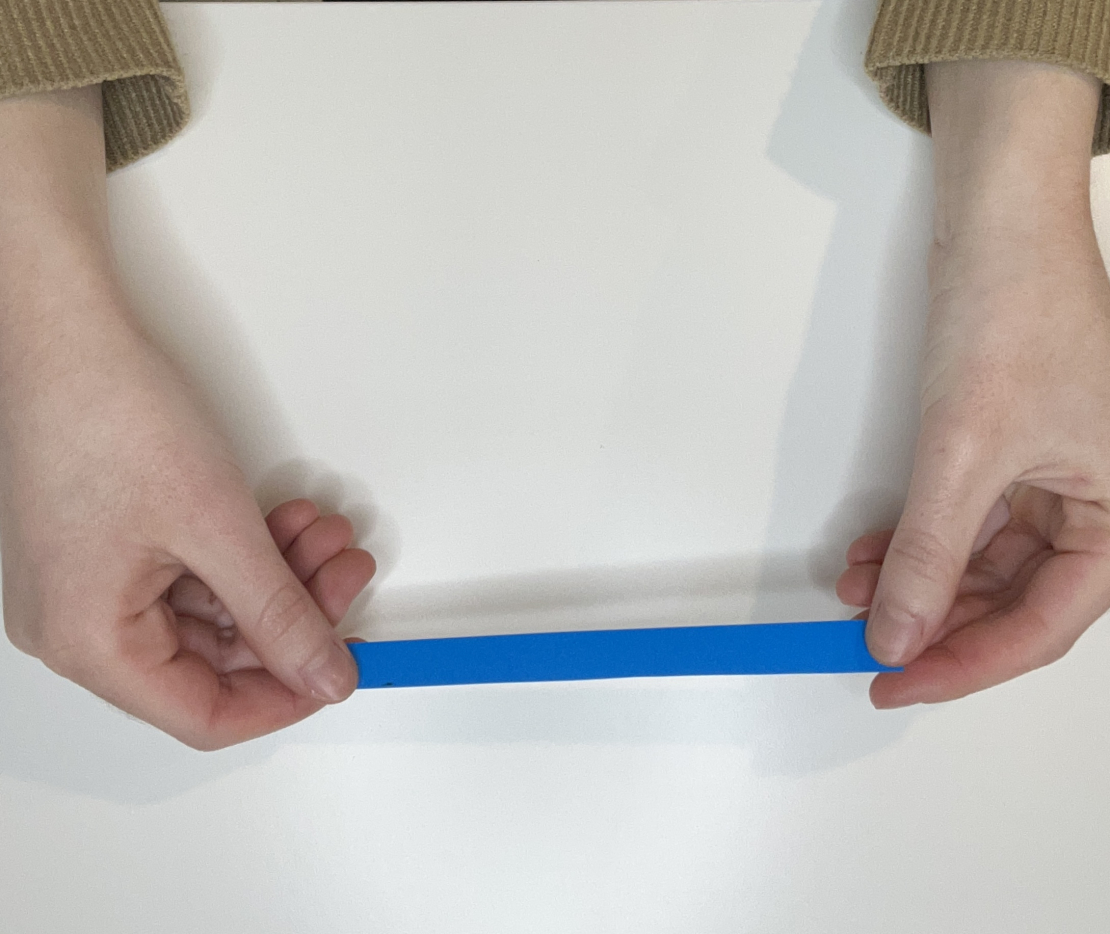 Hold your blue paper strip horizontally. 